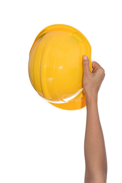 Woman Hand holding a hardhat, helmet isolated on white background - Foto, immagini