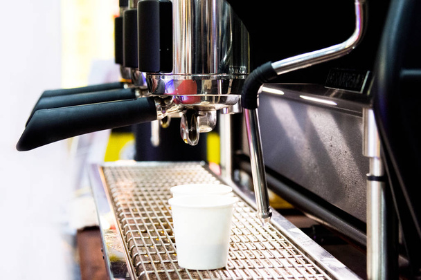 espresso shot from coffee machine in coffee shop,Coffee maker in coffee shop - Foto, Imagen