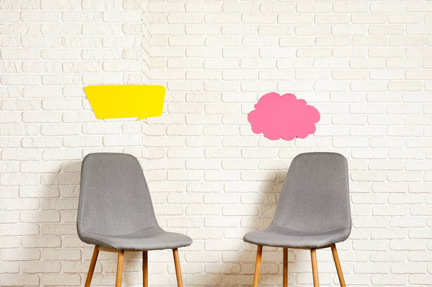 Empy loft style chair over blank wall background wit a lot of copy space for text. Available job position, interview or negotiations concept. - Zdjęcie, obraz