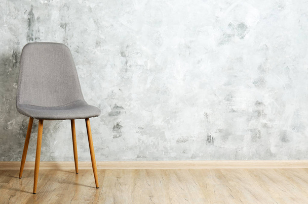 Empy loft style chair over blank wall background wit a lot of copy space for text. Available job position, interview or negotiations concept. - Foto, Bild