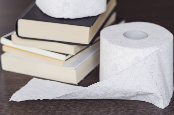 Toilet paper and books - Photo, Image
