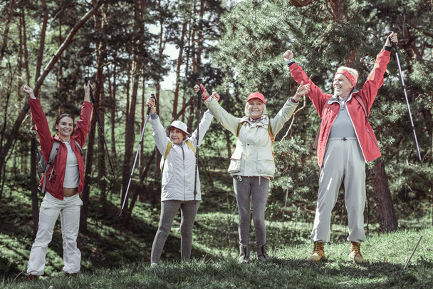 Trendy dynamic pensioners doing ecotourism during weekend - Фото, изображение