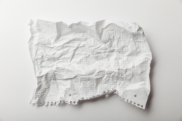 top view of blank squared crumpled page on white background - Φωτογραφία, εικόνα