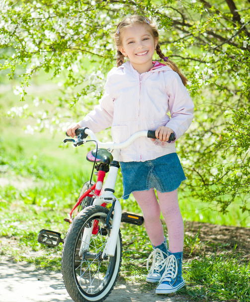 little girl on her bike - 写真・画像