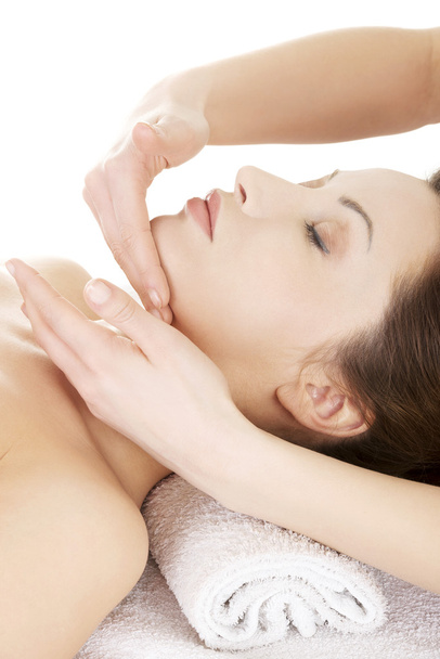Woman enjoy receiving face massage - Foto, imagen
