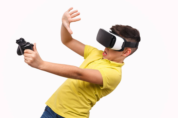Shocked boy with controller evading danger in virtual reality - Foto, Imagem
