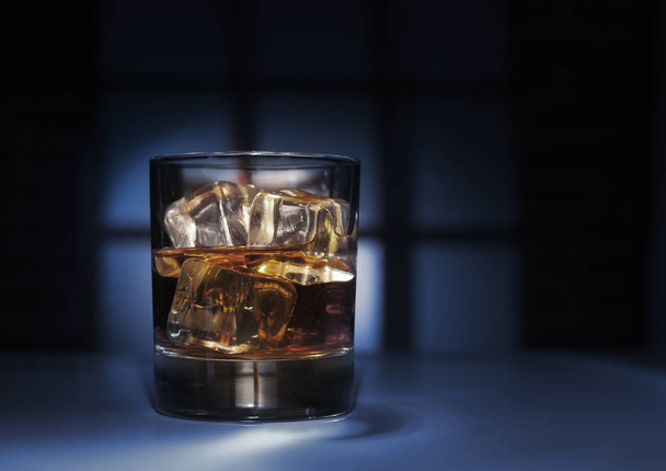 whiskey glass ice on dark beauty background, - Fotó, kép