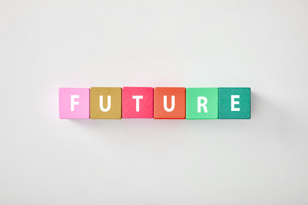 top view of future made of multicolored cubes on grey background - Photo, Image