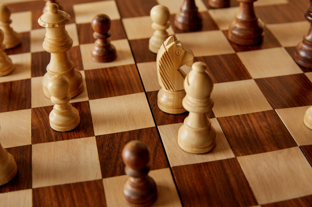 chess pieces on wooden brown chess board - Photo, Image