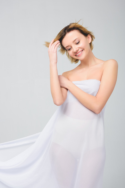 elegant smiling girl posing in white veil, isolated on grey - Zdjęcie, obraz