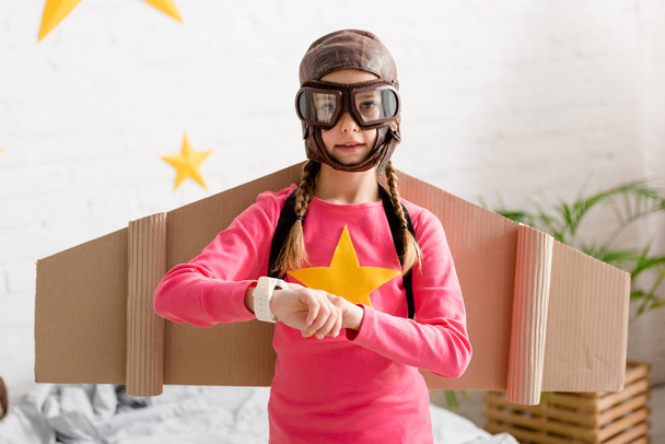 Cute child in helmet and goggles looking at camera - Photo, Image