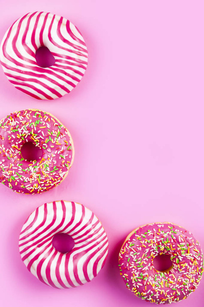 Donuts on a pink background. Delicious dessert. - Photo, Image
