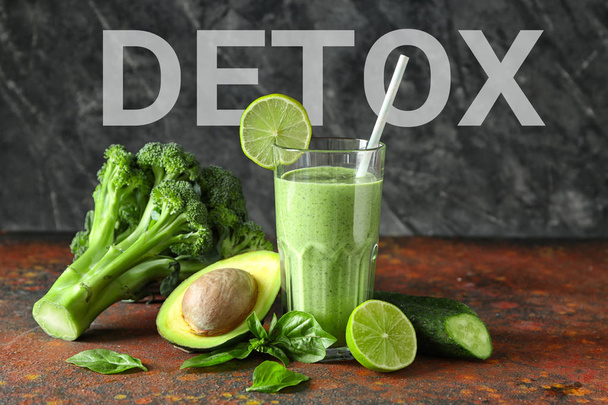 Glass of tasty green smoothie for detox diet on color table - Foto, Imagem