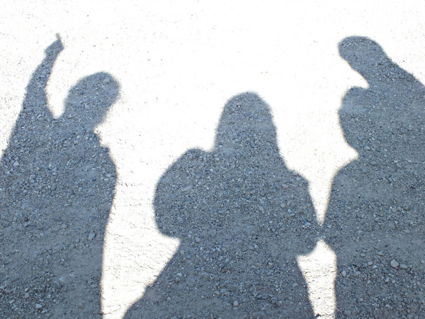 Drei Personen mit Schatten - Zdjęcie, obraz
