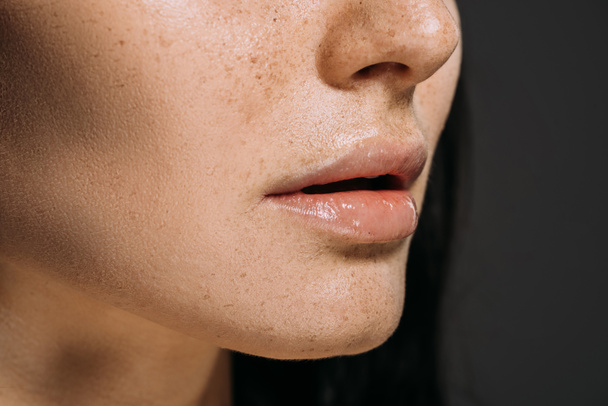 cropped view of girl with freckles on face isolated on grey - Photo, Image