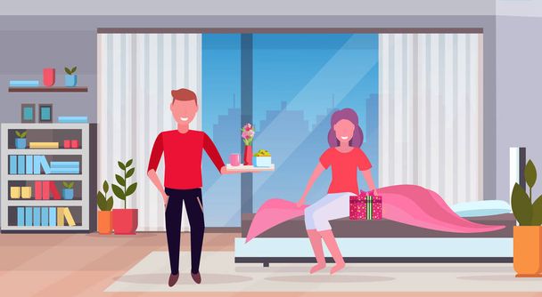 man bringing breakfast for his woman in bed happy 8 march womens day concept husband making surprise to wife modern bedroom interior full length flat horizontal - Вектор, зображення