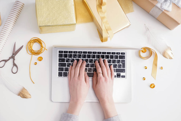 Female designer working with laptop on white background - Foto, Bild