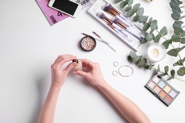 Beauty blogger with makeup cosmetics on white background - Φωτογραφία, εικόνα
