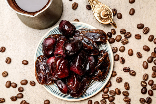Plate with tasty dates on table - Photo, Image