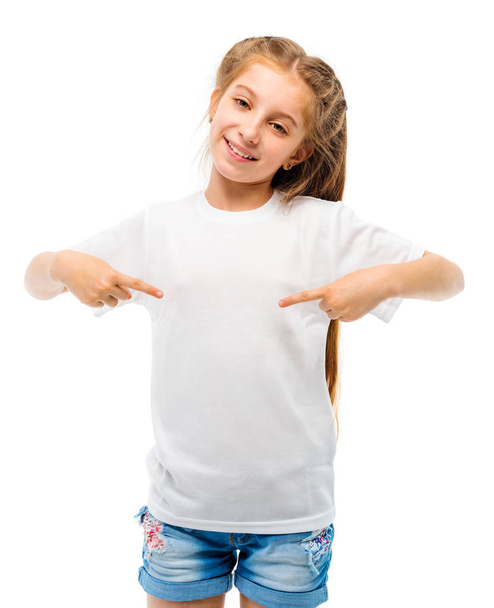 Little girl in casual white T-shirt on white backgtound. - Photo, Image