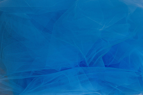 Texture of crumpled blue tulle fabric - Valokuva, kuva
