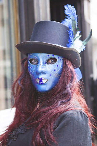 Young female in blue mask. - Foto, afbeelding