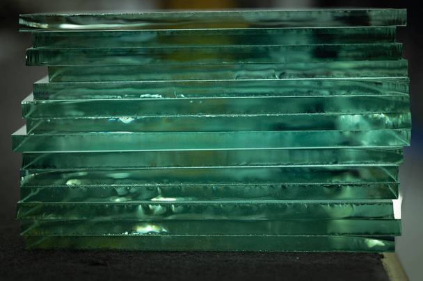 pieces of transparent glass stacked on each other and creating reflections - Photo, Image