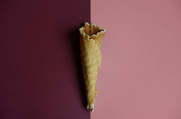 Waffle cone on colored geometric shapes - Foto, imagen