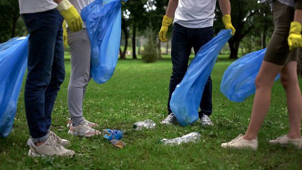 Society against pollution, active citizens collecting garbage in public park - Valokuva, kuva