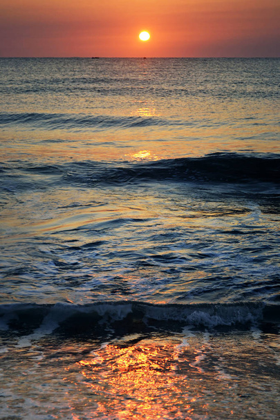 Sunset/ sunrise on a beach - 写真・画像