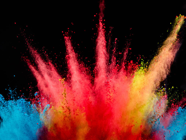 Explosion of colored powder isolated on black background. Abstract colored background - Φωτογραφία, εικόνα