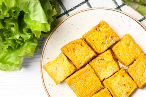 Plate with tasty tofu cheese on table - Photo, Image