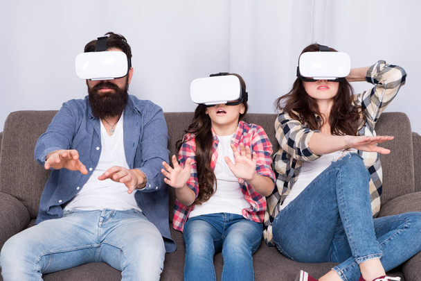 Live Life Your Way. Creating Memories. Virtual reality. vr love. vr family. Happy family in vr glasses. Bearded man and woman with little girl. surprised little girl child with mother and father - Photo, Image