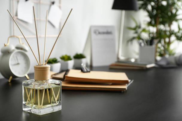 Reed diffuser on table in room - Photo, Image