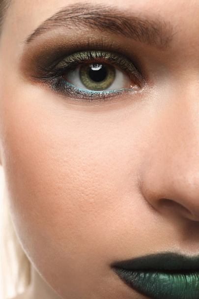 Beautiful young woman with bright makeup, closeup - Фото, изображение