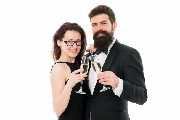 Cheers concept. Couple classy clothes drink champagne white background. Man bearded wear tuxedo girl elegant celebrate anniversary. Holiday celbration. Party celebration. Official celebration event - Foto, Imagem