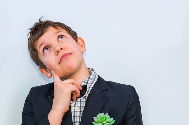 dreaming boy teen in suit with bow tie - Foto, Bild