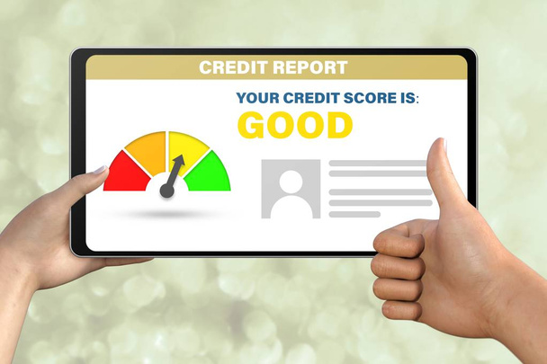 good credit score technology concept - hand with tablet pc shows like, thumb up   on abstract bokeh background - Valokuva, kuva