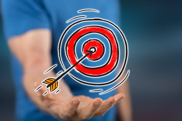Business target concept above the hand of a man in background - Photo, Image
