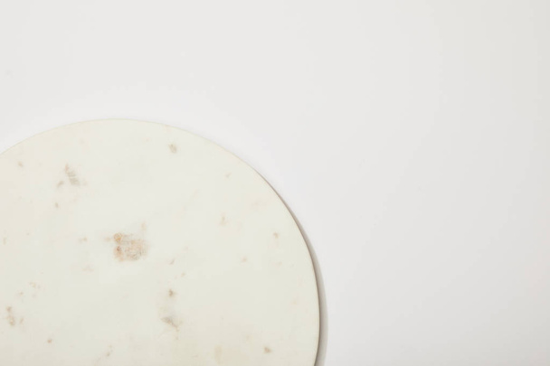 top view of empty marble round board on white background - Photo, Image