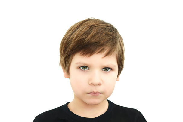 sad boy in black t-shirt on white background - Photo, Image