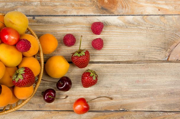 Various summer Fresh berries in a bowl on rustic wooden table. .Antioxidants, detox diet, organic fruits - Φωτογραφία, εικόνα