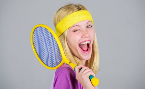 Start play game. Sport for maintaining health. Athlete hold tennis racket in hand. Tennis club concept. Active leisure and hobby. Tennis sport and entertainment. Girl adorable blonde play tennis - 写真・画像