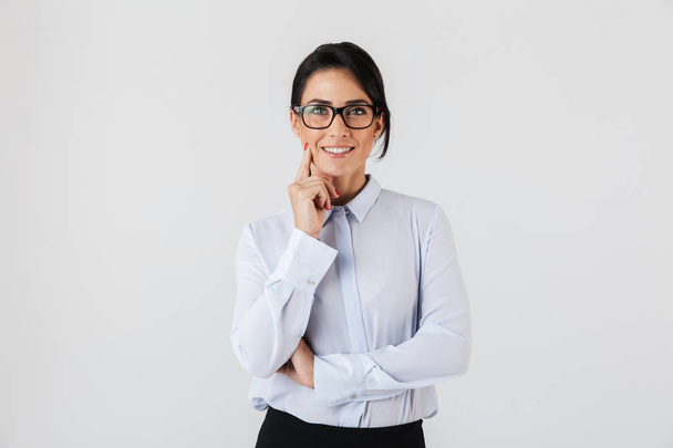 Photo of successful businesswoman wearing eyeglasses standing in the office isolated over white background - Foto, Imagen