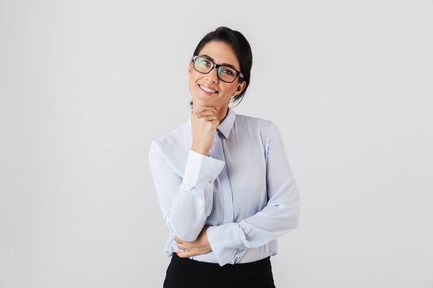 Image of successful secretary woman wearing eyeglasses standing in the office isolated over white background - Fotoğraf, Görsel