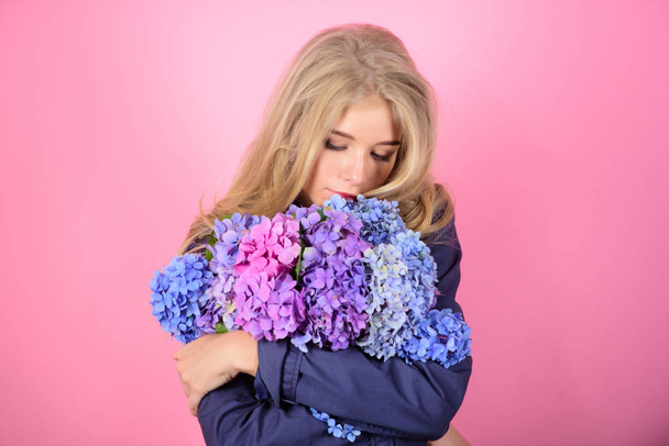 Skin care and beauty treatment. Gentle delicate flower. Pure beauty. Tenderness of young skin. Springtime bloom. Simple beauty. Girl cute blonde hug hydrangea flowers bouquet. Natural beauty concept - Zdjęcie, obraz