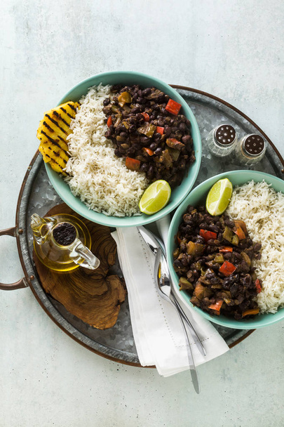 Cuban rice and black bean dish with grilled pineapple. Healthy Vegan Caribbean food for the whole family, party or restaurant menu - Zdjęcie, obraz