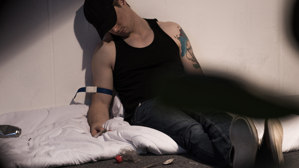 selective focus of sleeping addict man affected by narcotic  - Photo, Image