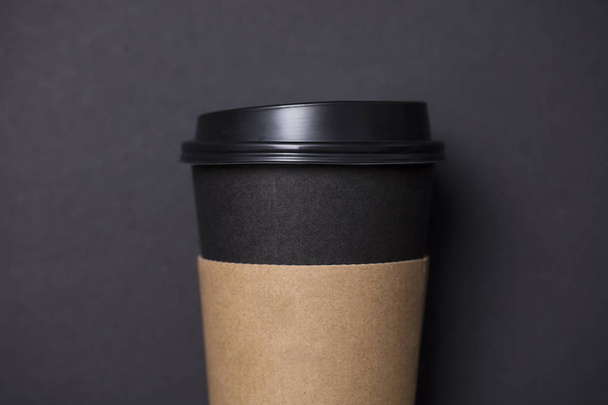 Black coffee cup with blank brown label - Fotoğraf, Görsel