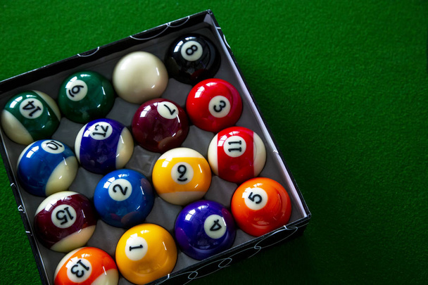Colorful billiard balls in box the on table - Photo, Image